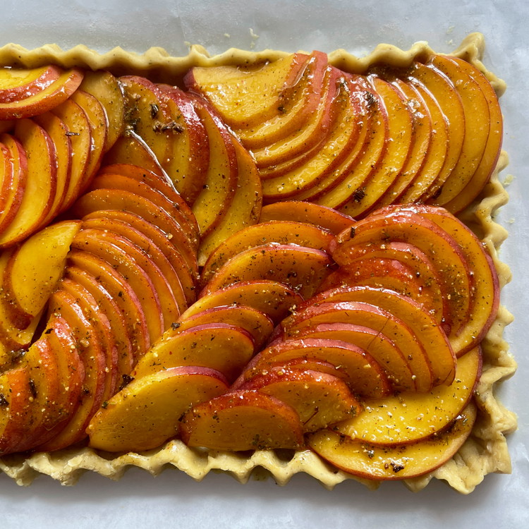 Image of In a small bowl, mix all of the remaining filling ingredients well to combine.  Brush all of the mixture evenly over the peaches in the tart, making sure all the peaches get a brushing of the seasoning liquid and that...